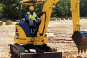 New Komatsu Excavator being worked in field